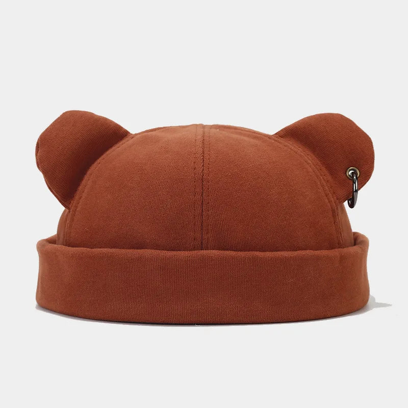 Fashionable unisex bear ears beanie. This soft knit cozy hat is a playful and warm accessory for winter style.