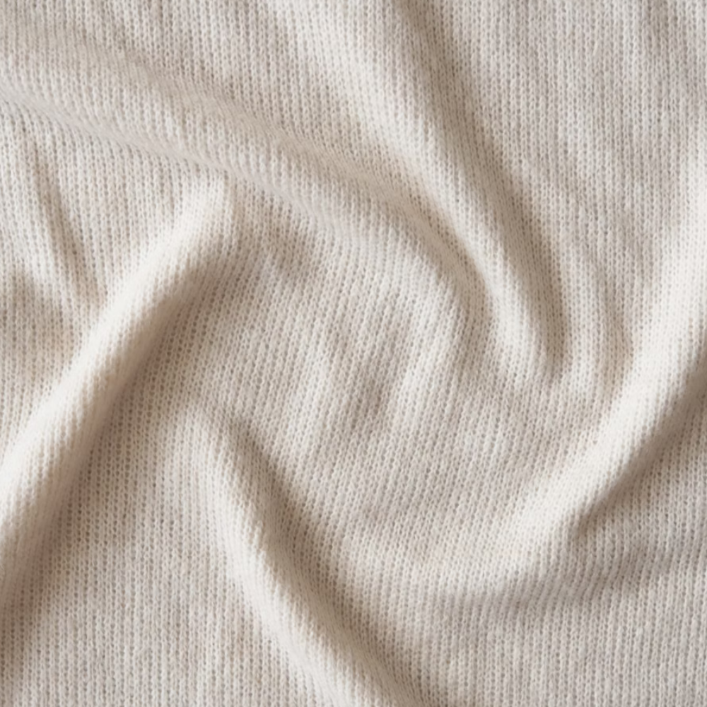 Elegant beige knitted cardigan for women, offering ultimate comfort & a stylish look for any outfit.