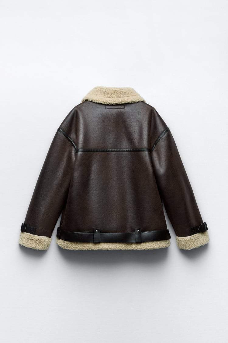 Fashionable women's brown lapel jacket. Cozy outerwear for autumn and winter style. Chic and versatile coat.
