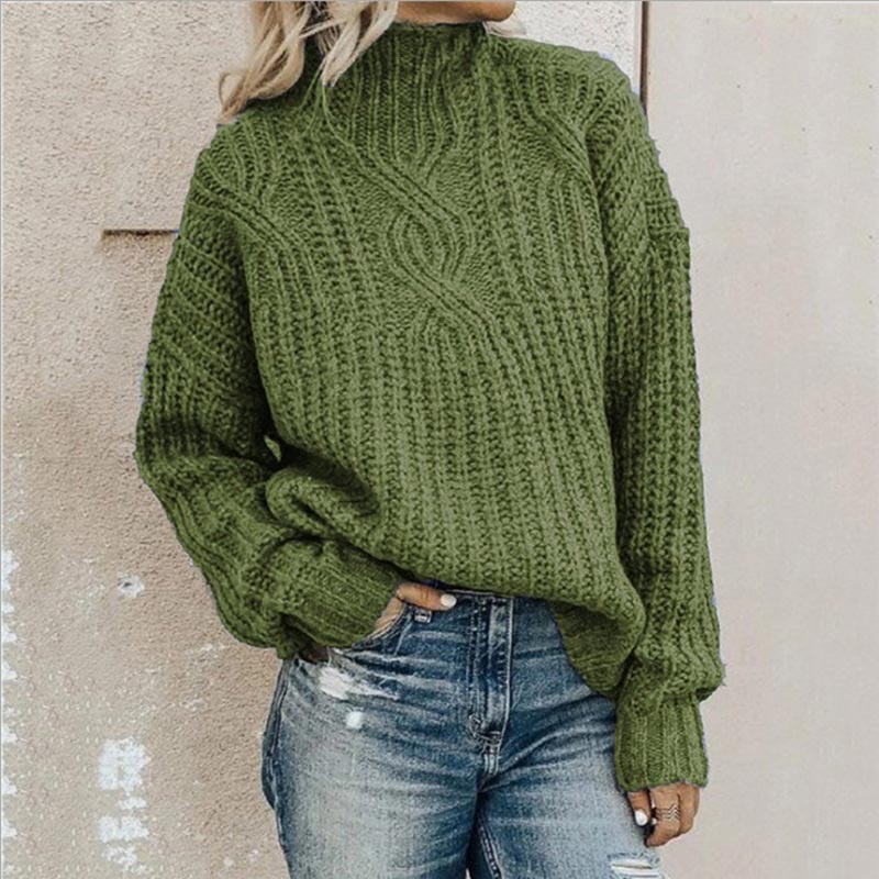 Cozy women's cable knit roll neck sweater in soft yarn, perfect for warm winter and fall fashion.