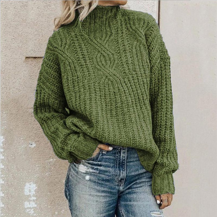 Cozy women's cable knit roll neck sweater in soft yarn, perfect for warm winter and fall fashion.
