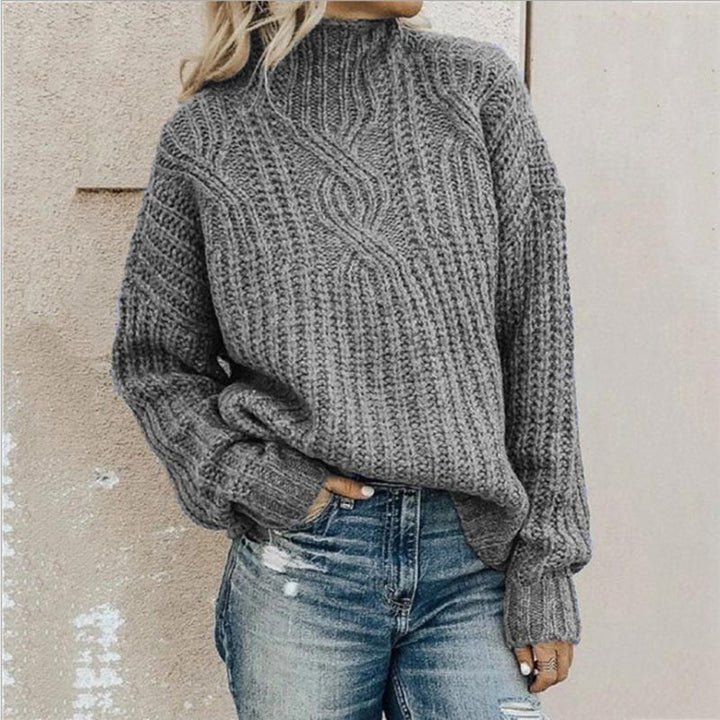 Chic women's cable knit roll neck sweater. Ideal for autumn and winter, offering cozy style and warmth.