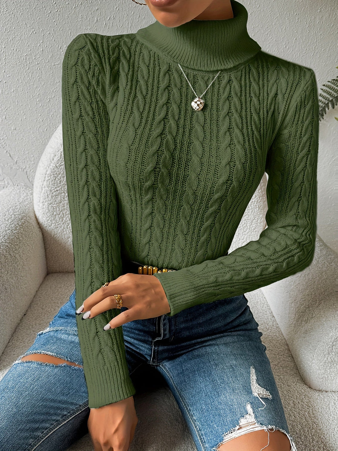 Classic women's cable knit turtleneck sweater. A cozy long sleeve top, perfect winter knitwear for any occasion.