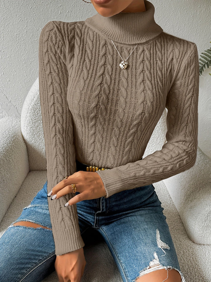 Warm & stylish women's cable knit turtleneck sweater. Cozy long sleeve top, essential for cold weather fashion.
