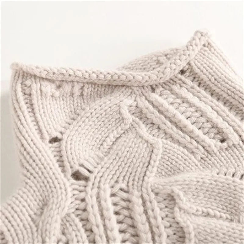 Model wearing a comfortable women's long-sleeve knit sweater. Ideal cozy pullover for versatile everyday casual fashion.