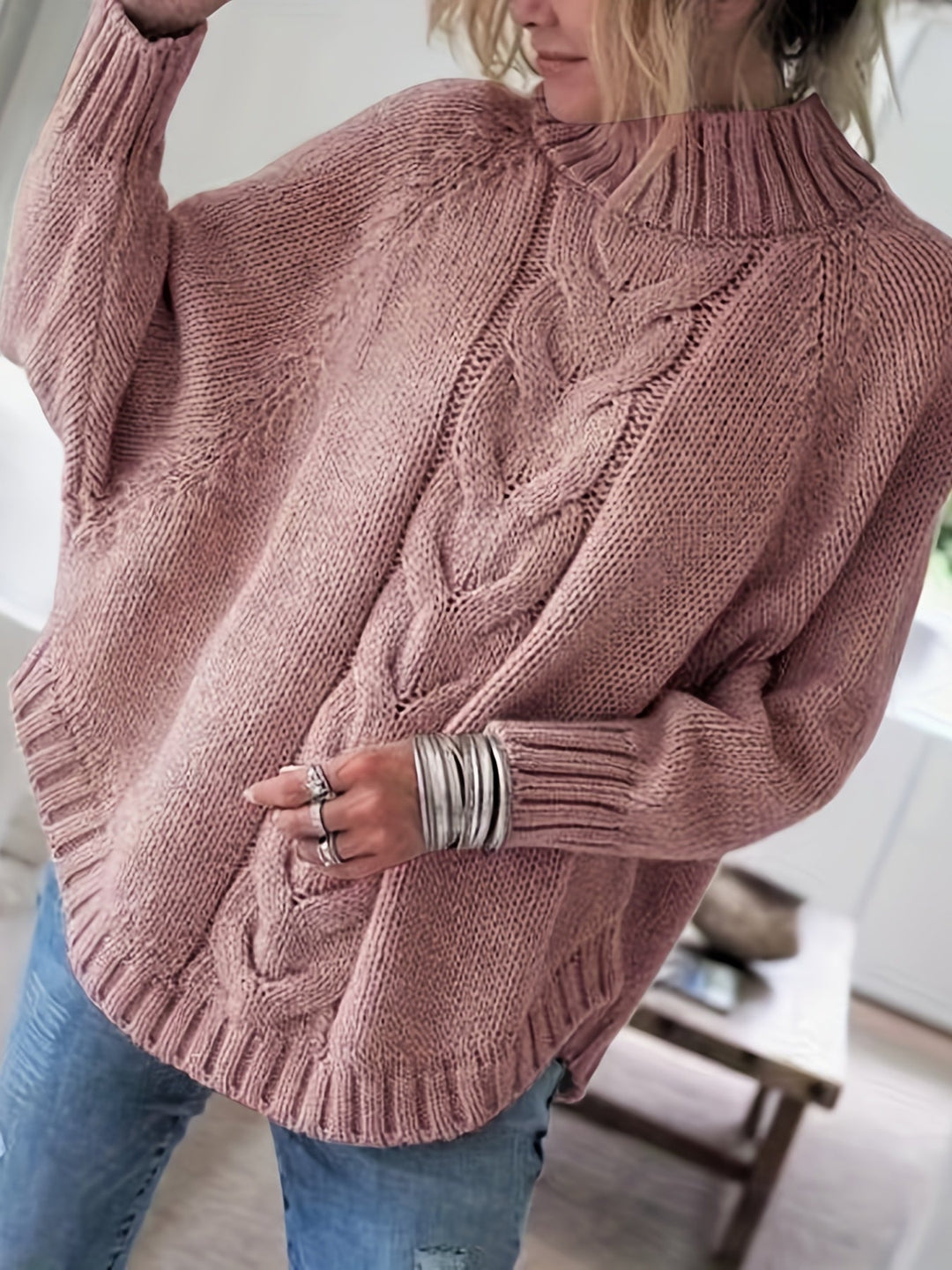 Cozy women's high-neck textured sweater for fall. Relaxed fit, batwing sleeve, and warm everyday style.