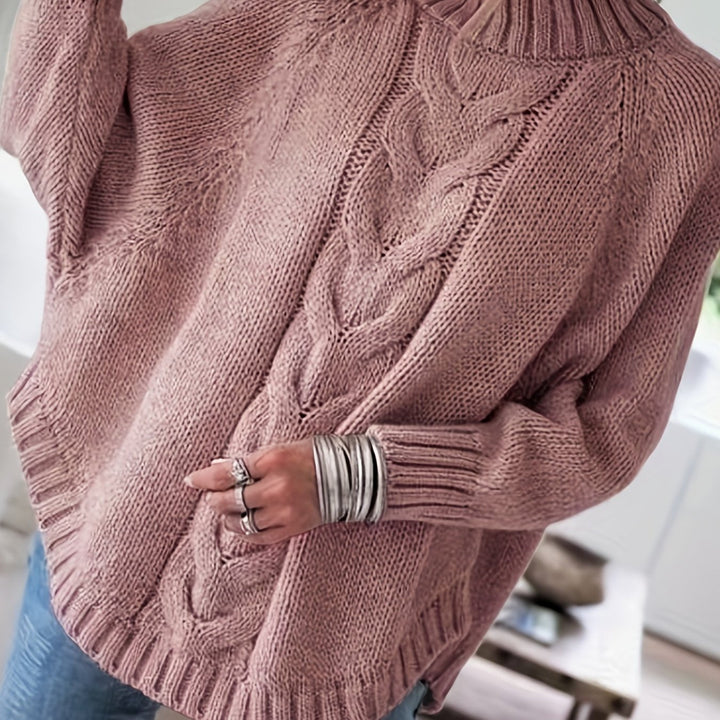 Women's high-neck textured sweater with batwing sleeves and a flared hem for cozy fall and winter style.