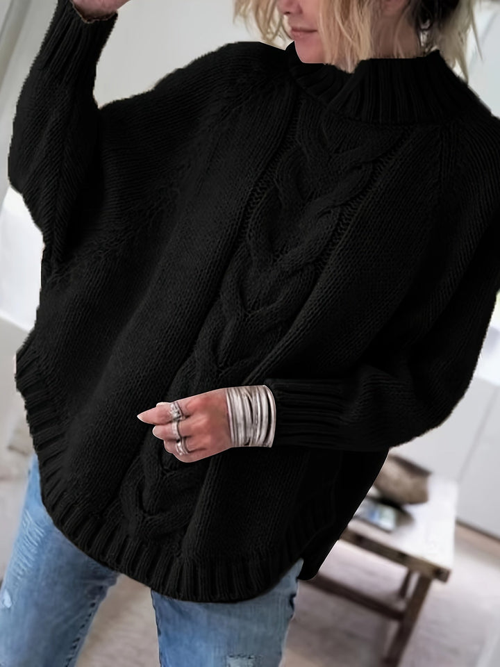 Oversized women's textured high-neck sweater with batwing sleeves and flared hem for casual fall wear.