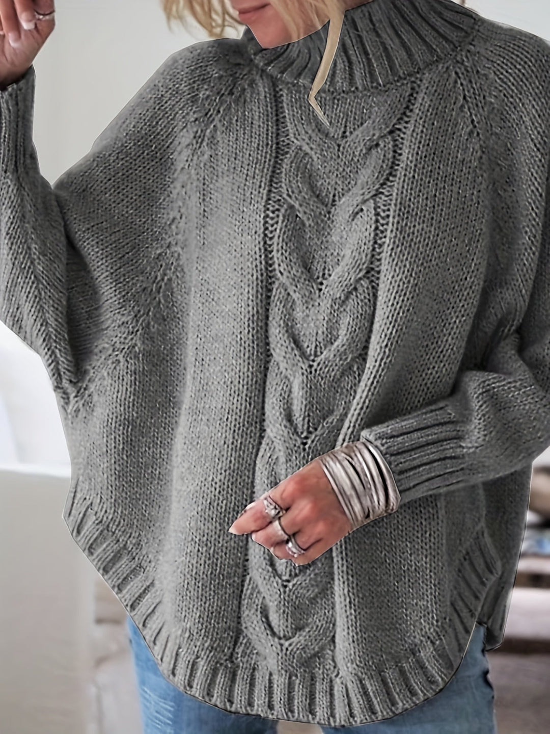 Stylish women's textured high-neck sweater with a relaxed fit, batwing sleeve, ideal for fall fashion.