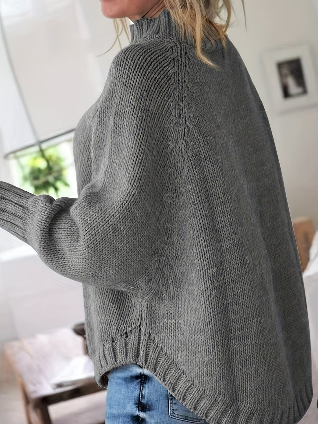 Intricately textured women's high-neck sweater. Cozy, warm, and stylish for fall and winter fashion.