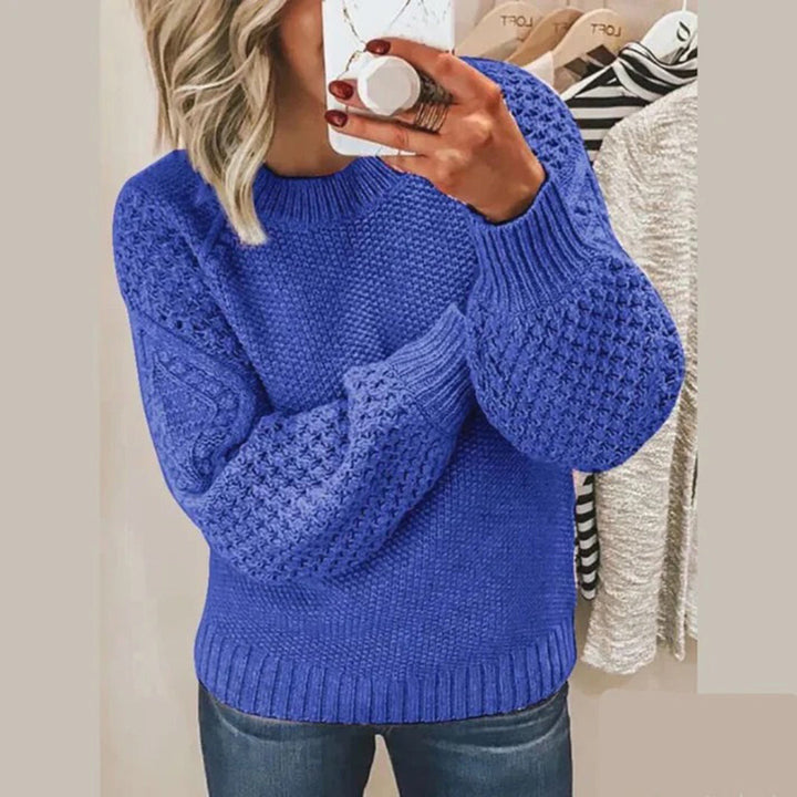 Cozy women's knitted sweater with a stylish round neck, perfect for fall fashion and winter warmth.