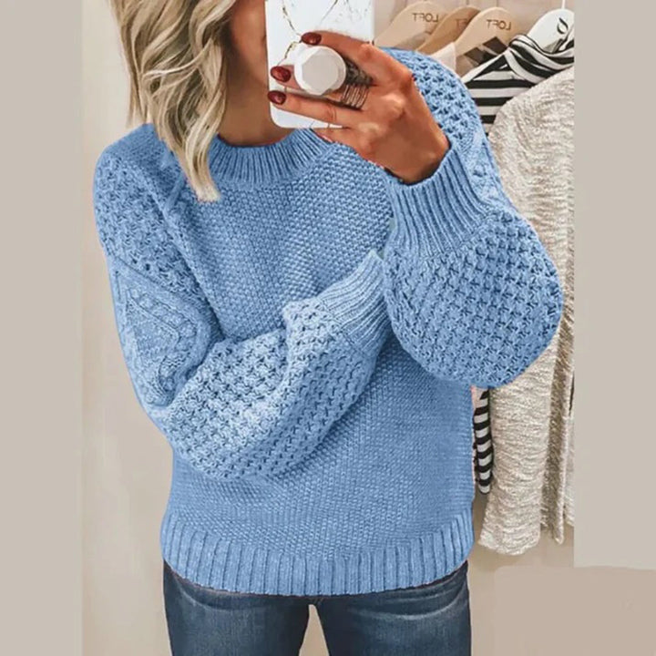 Soft women's round-neck knitted sweater, providing cozy winter warmth and stylish comfort for daily wear.