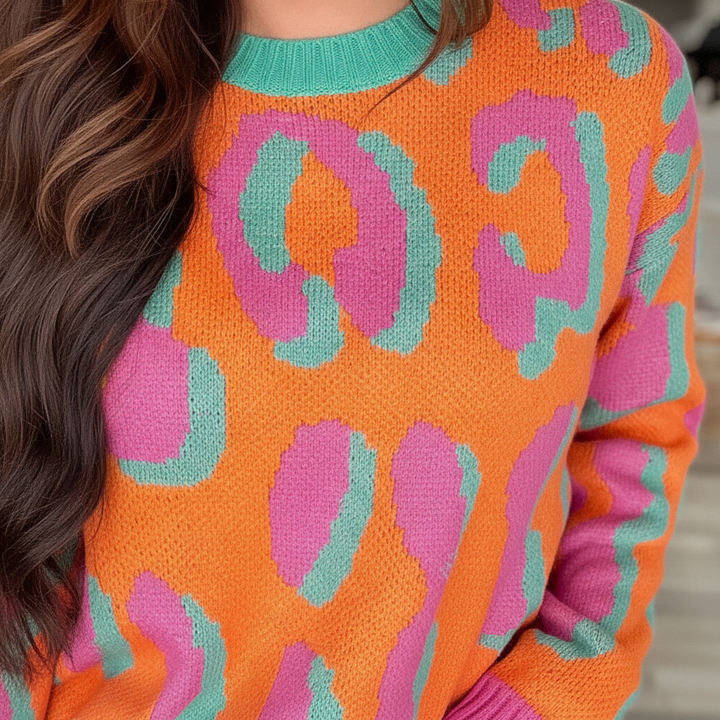 Stylish women's patterned knitted top with bold leopard print, comfortable and warm