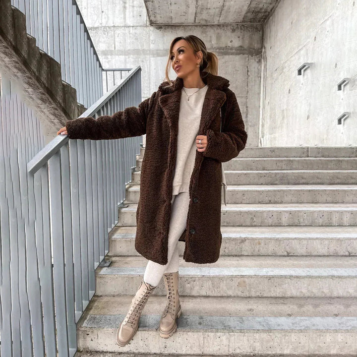 Cozy women's long teddy coat. Soft, warm outerwear perfect for winter fashion & stylish layering. Relaxed fit jacket.