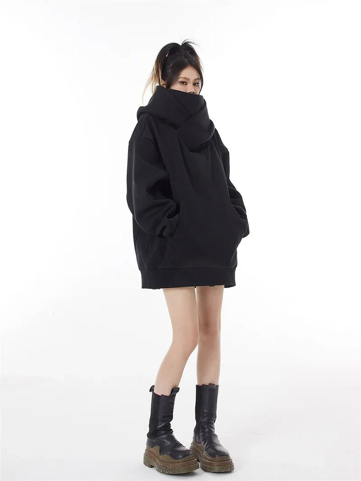 Versatile women's oversized hoodie, a cozy and warm casual top perfect for loungewear or fall/winter outerwear.