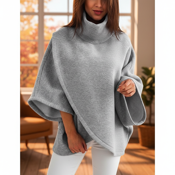 Cozy women's oversized knit roll-neck sweater in a warm winter fashion style