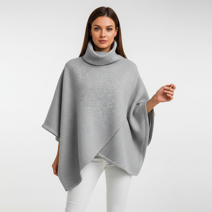 Close-up of the textured knit on a women's oversized, comfortable roll-neck sweater