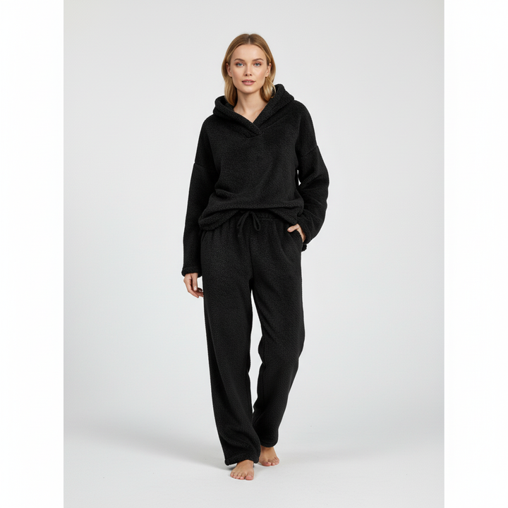 Warm women's fleece loungewear set, featuring a hoodie and pants in a cozy fabric.