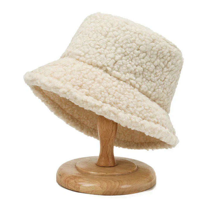 Cozy women's plush teddy bucket hat in light brown, perfect winter fashion accessory