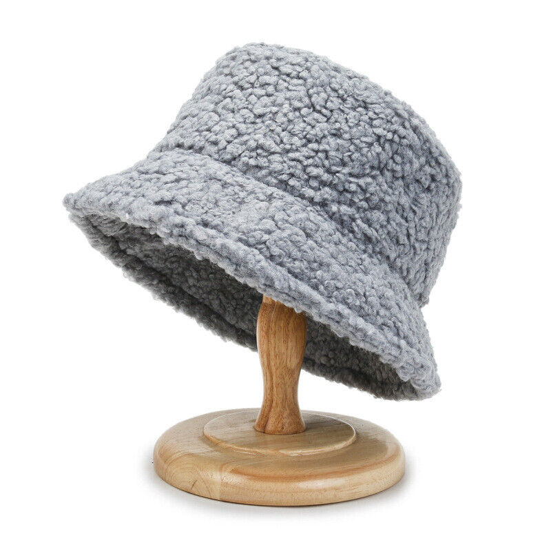 Women modeling a comfortable and chic plush teddy bucket hat, a must-have accessory