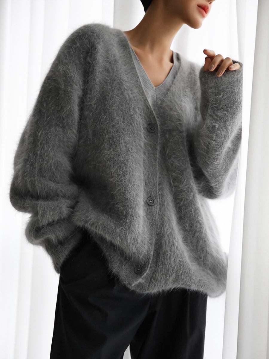 Cozy women's soft knit V-neck cardigan in a relaxed fit, perfect for comfortable everyday wear or stylish layering.