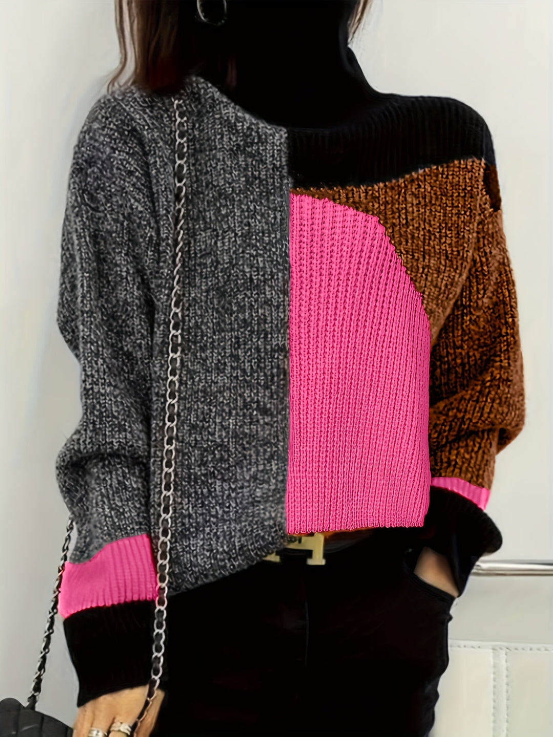 Relaxed fit women's cozy knit turtleneck sweater. Warm, long sleeve design for casual winter comfort.