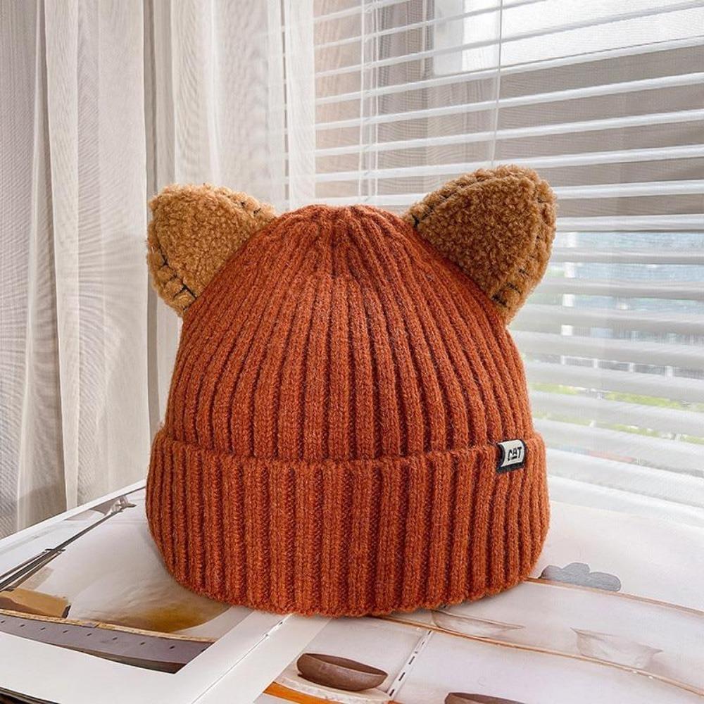 Women's cozy cat ears winter beanie, a cute knitted hat for cold weather and playful style.