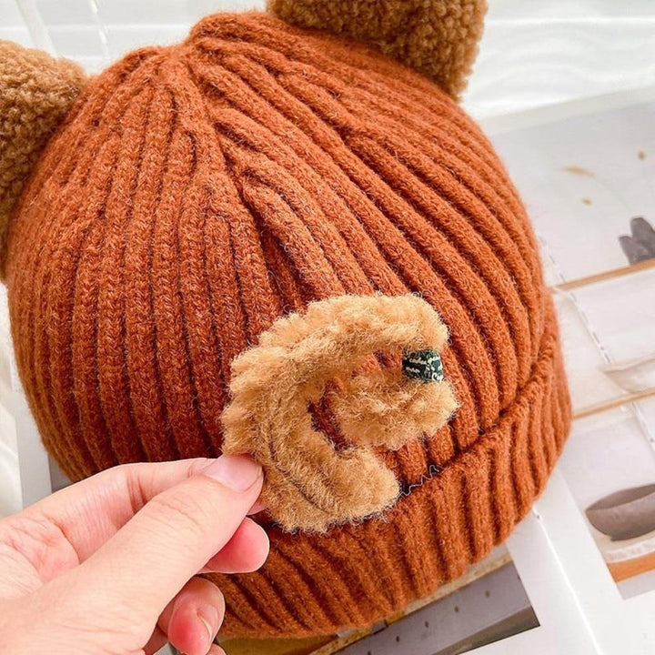 Cute women's cat ears winter hat, a cozy knitted beanie perfect as a playful fashion gift for ladies.