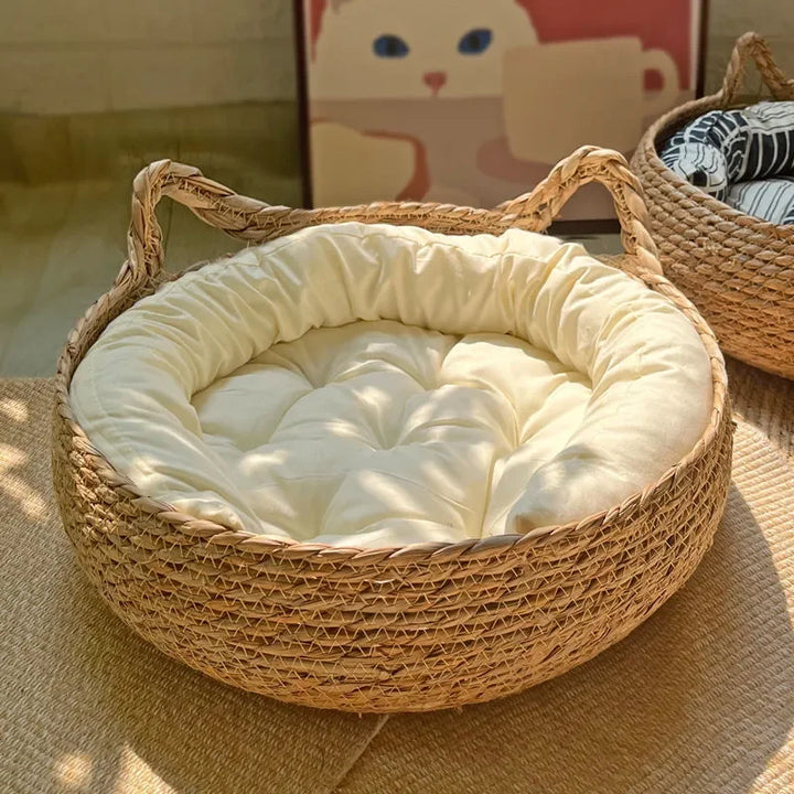 Hand-woven rattan cat bed with soft cushion for year-round comfort. Durable & washable pet furniture for cats & kittens.