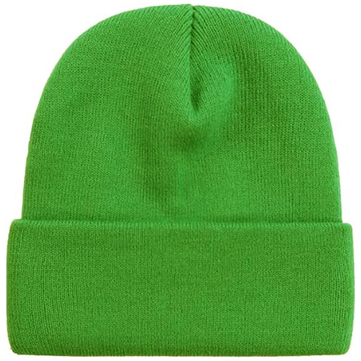 Model wearing a stylish CozyCap warm knitted winter beanie in forest green outdoors