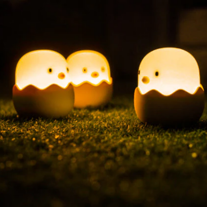 Softly glowing chick night light for kids' bedroom, a sweet baby gift for a calm and comforting bedtime.