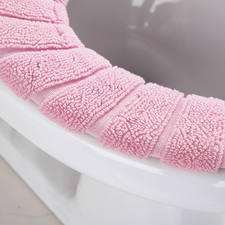 Close-up of plush CozySeat padded toilet cover, soft polyester for ultimate bathroom comfort