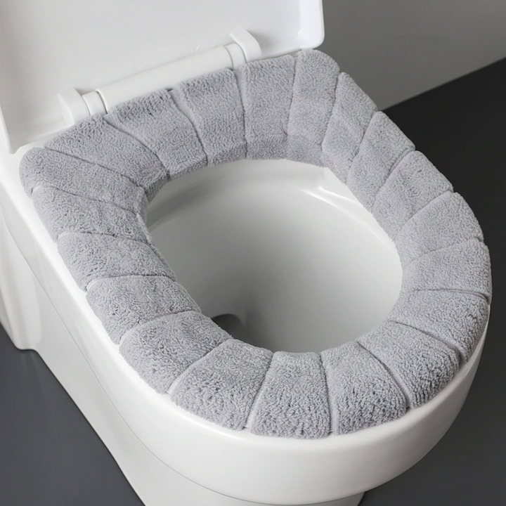 Soft polyester padded toilet seat cover, CozySeat brand, offering warmth and comfort for all