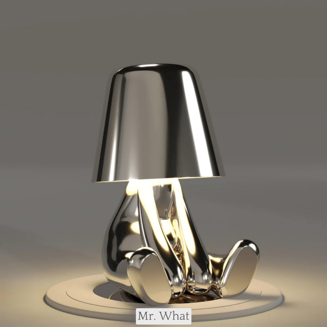 Elegant LED desk lamp featuring creative thinker figure. Great for office decor.