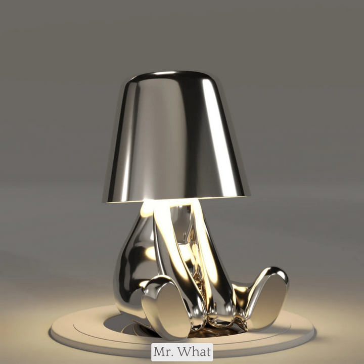 Elegant LED desk lamp featuring creative thinker figure. Great for office decor.