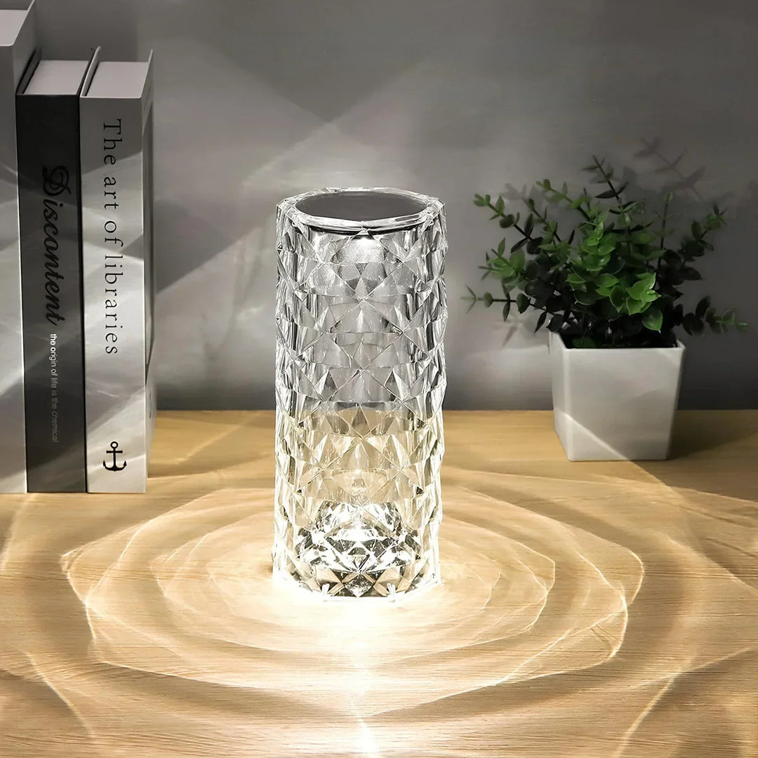 Product shot of the crystal touch table lamp with its remote control, highlighted on a white background