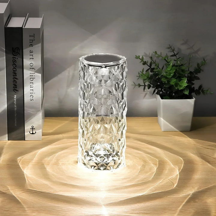 Product shot of the crystal touch table lamp with its remote control, highlighted on a white background