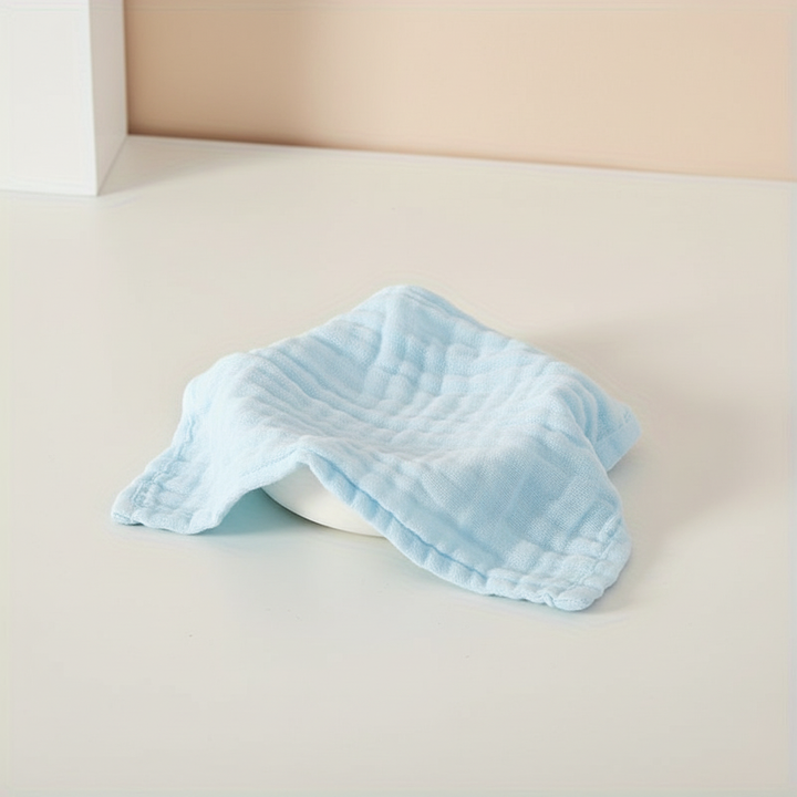 Breathable CuddleWrap muslin cloths in various pastel colors, perfect as soft baby washcloths