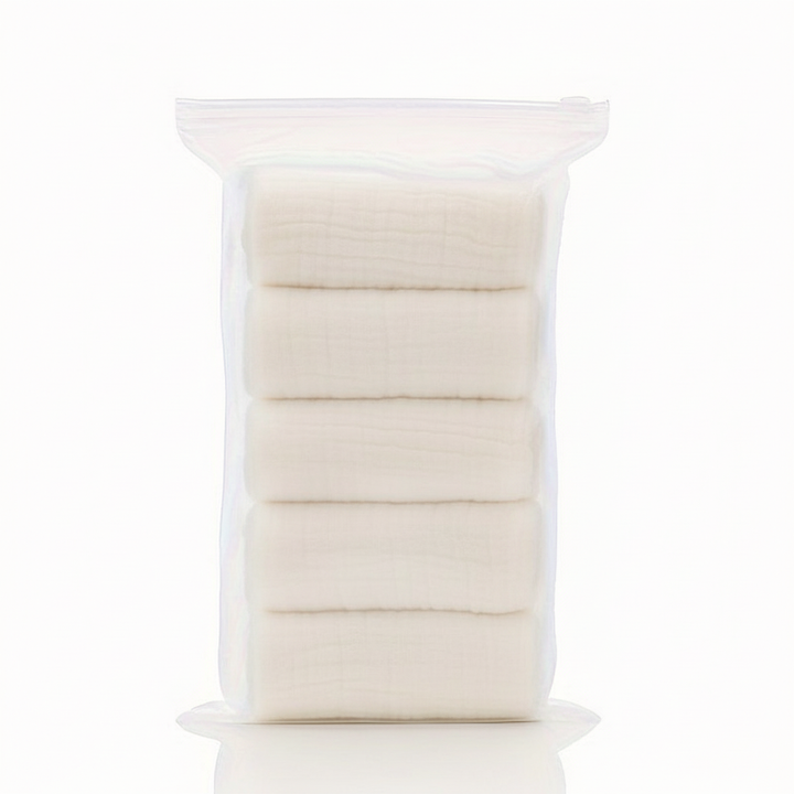 CuddleWrap baby washcloth being used to gently clean an infant, showcasing its soft fabric