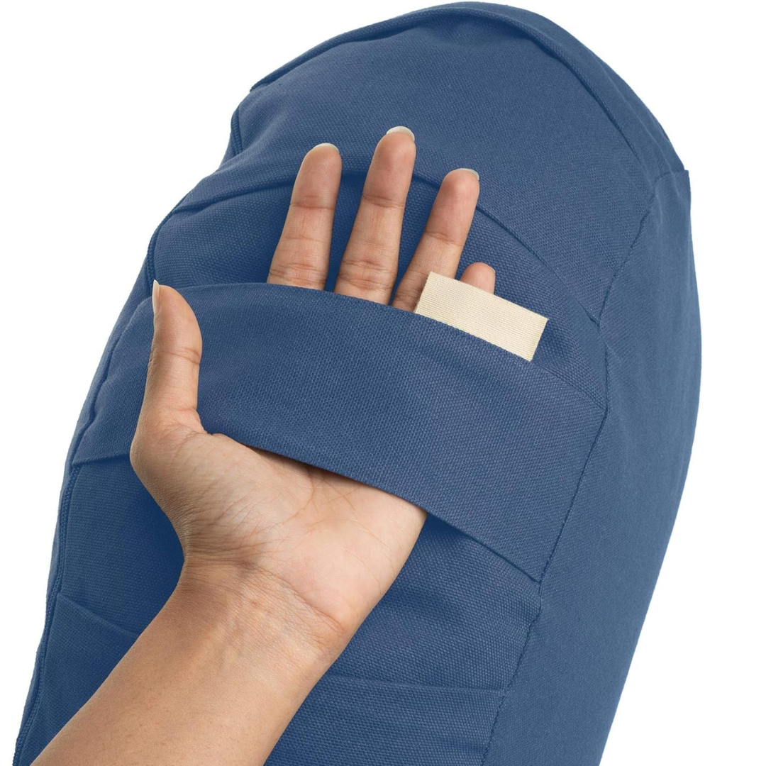 Curved organic cotton meditation cushion with buckwheat fill & washable cover for comfy posture support.