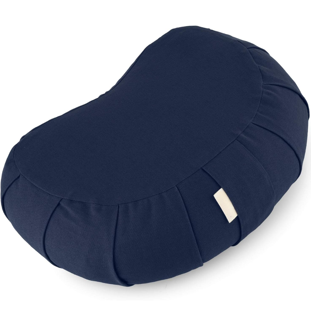 Soft organic cotton curved yoga pillow with durable buckwheat fill and a practical removable, washable cover.