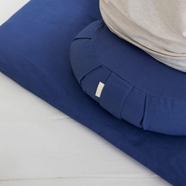 Stylish curved yoga pillow with soft organic cotton & a removable, washable cover for easy care.