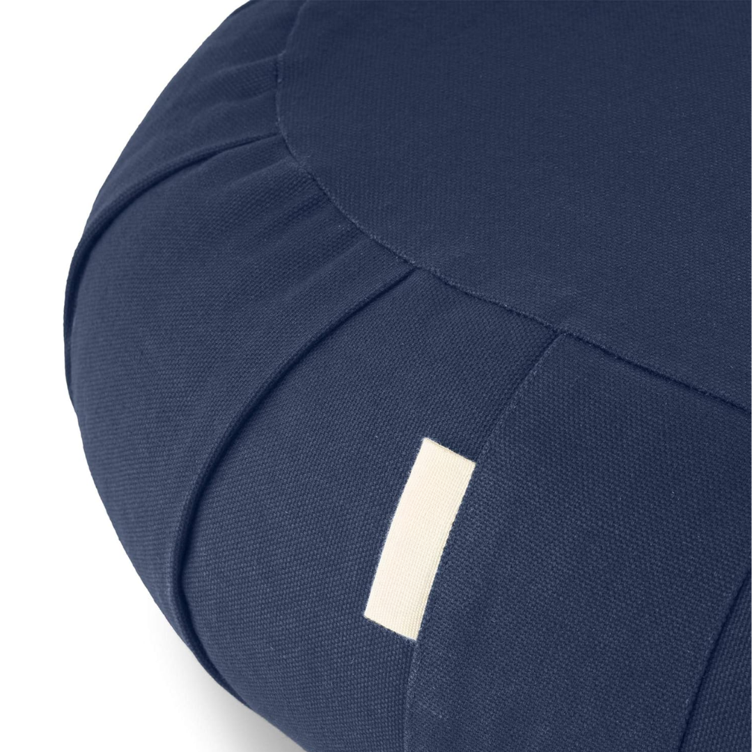 Premium curved organic cotton meditation cushion, filled with buckwheat, providing excellent posture & comfort.
