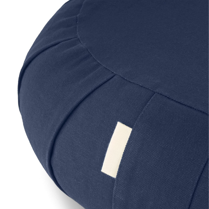 Premium curved organic cotton meditation cushion, filled with buckwheat, providing excellent posture & comfort.