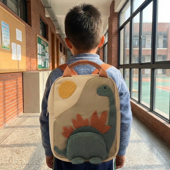 Toddler's adventure dinosaur backpack with adjustable straps. Perfect beige kids bag for school & outdoor fun.