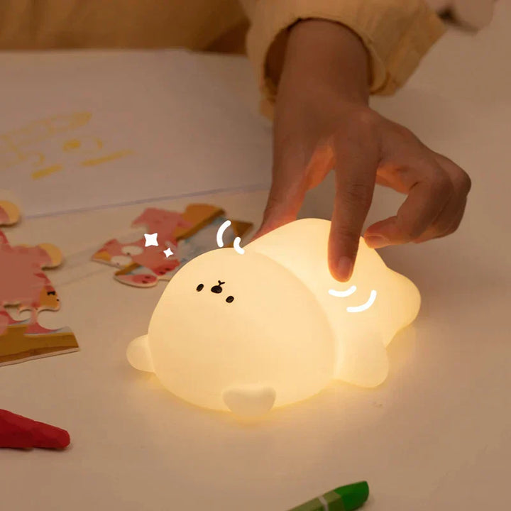 Adorable toddler bear night light. Portable & squishy silicone, touch-activated for a comforting glow.