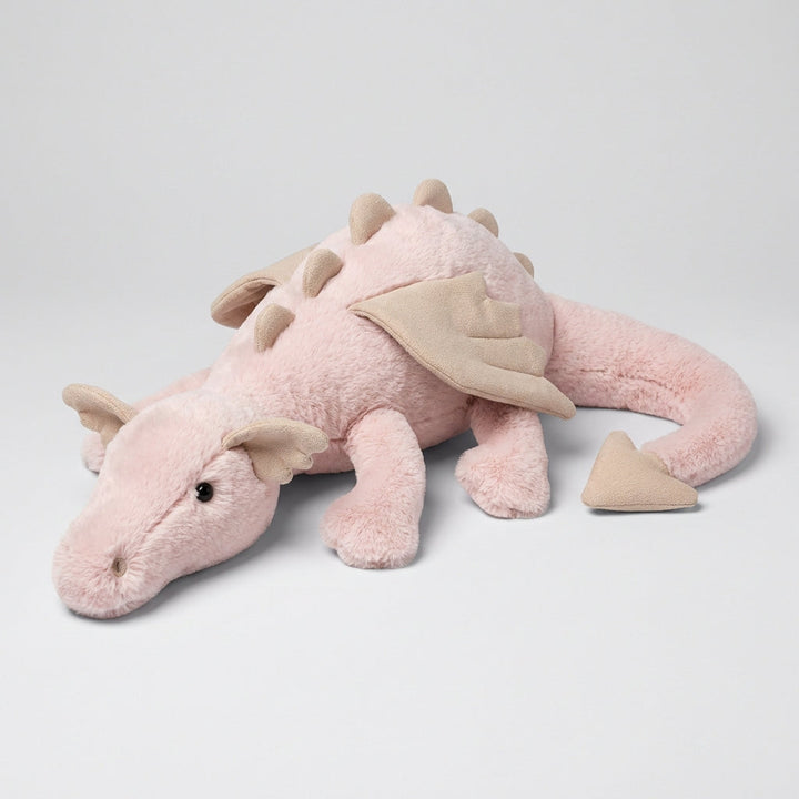 Soft fantasy dragon plush with adorable wings, perfect for a child's nursery or as a cuddly playroom toy.