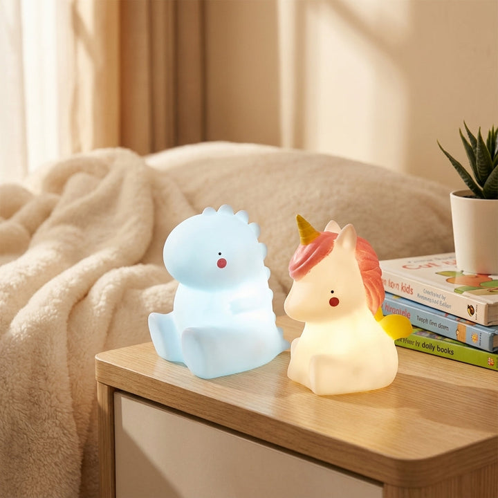Cute green Dreamasaur dinosaur LED night light for kids' bedroom, soft comfort glow bedside lamp, nursery decor.