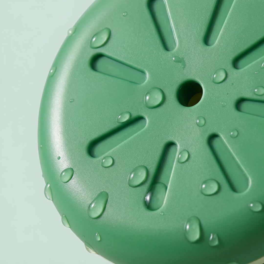 Floating frog bath toy actively sprinkling water, bringing interactive fun to kids' bath time, a great water toy.