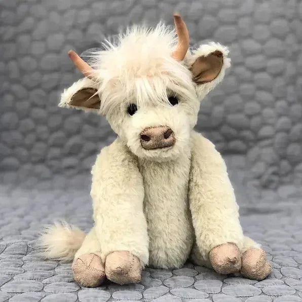 Cute Highland cow plush toy wearing a vibrant floral headband, perfect for unique decor or a collectible farm animal gift.